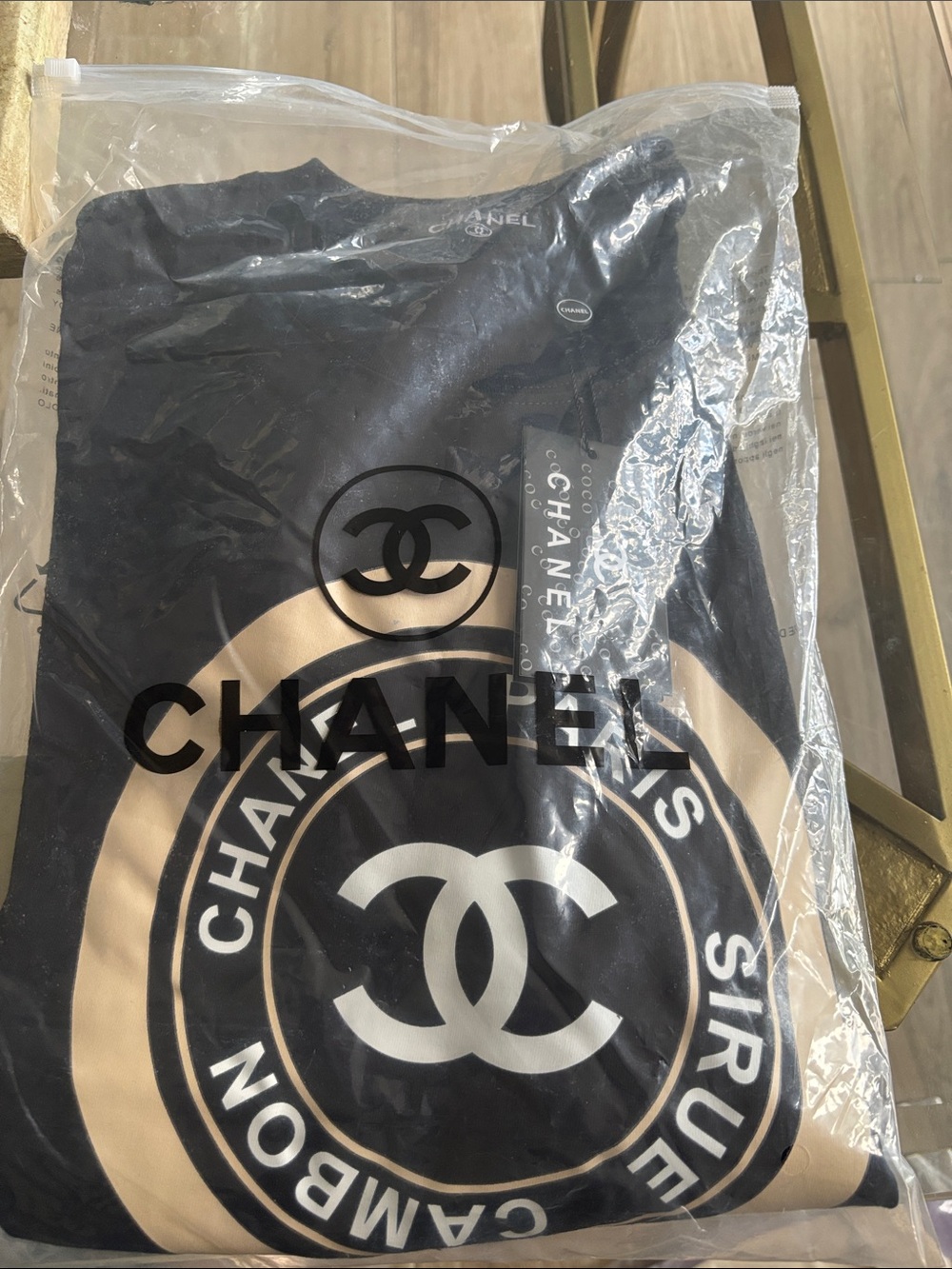 Source Unknown Black Tee with Beige Logo Graphic